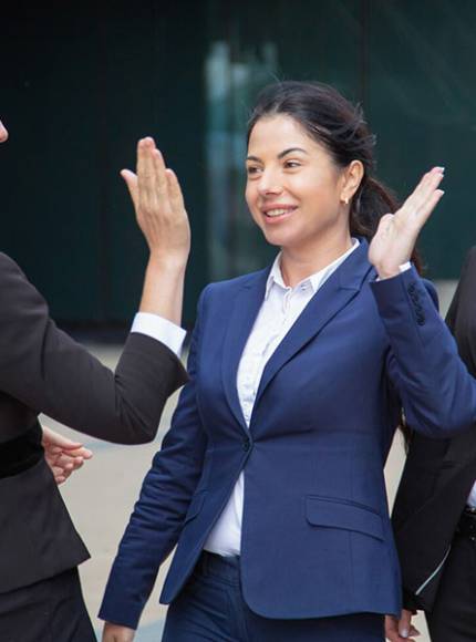 happy-successful-business-ladies-giving-high-five-businesswomen-wearing-suits-meeting-city-team-success-teamwork_900x600
